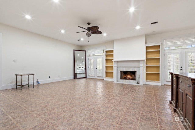 living room with ceiling fan and french doors