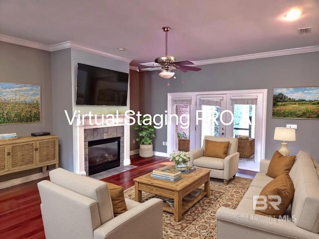 306 S Tee Dr, Fairhope, AL 36532 - living area featuring crown molding, wood finished floors, a tiled fireplace, and ceiling fan