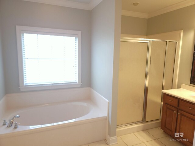 306 S Tee Dr, Fairhope, AL 36532 - bathroom with vanity, a shower stall, a bath, tile patterned flooring, and ornamental molding