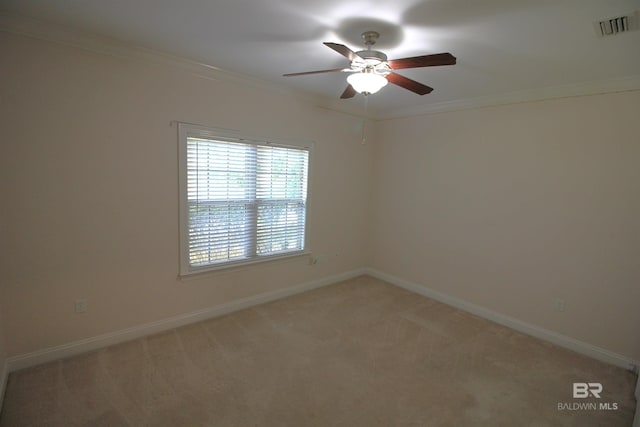306 S Tee Dr, Fairhope, AL 36532 - unfurnished room featuring ceiling fan, ornamental molding, and light carpet