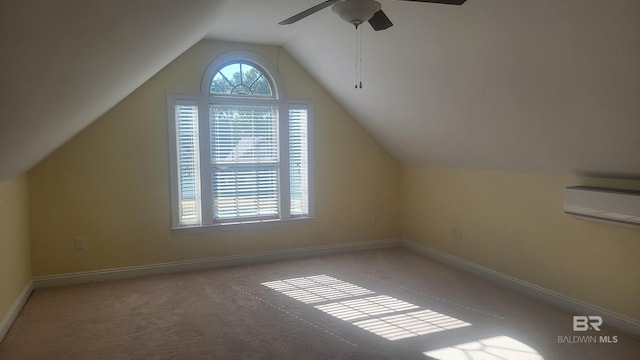 306 S Tee Dr, Fairhope, AL 36532 - additional living space featuring an AC wall unit, vaulted ceiling, ceiling fan, and carpet