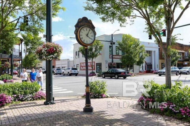 306 S Tee Dr, Fairhope, AL 36532 - view of asphalt road featuring street lighting, sidewalks, and curbs