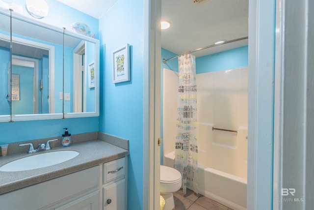 full bathroom with vanity, tile patterned floors, toilet, and shower / bath combo