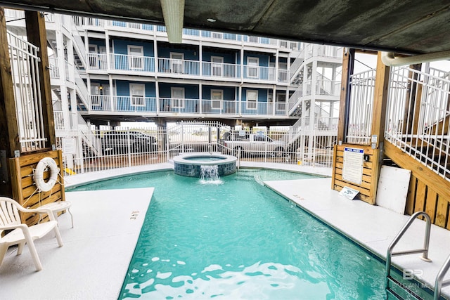 view of pool featuring a community hot tub