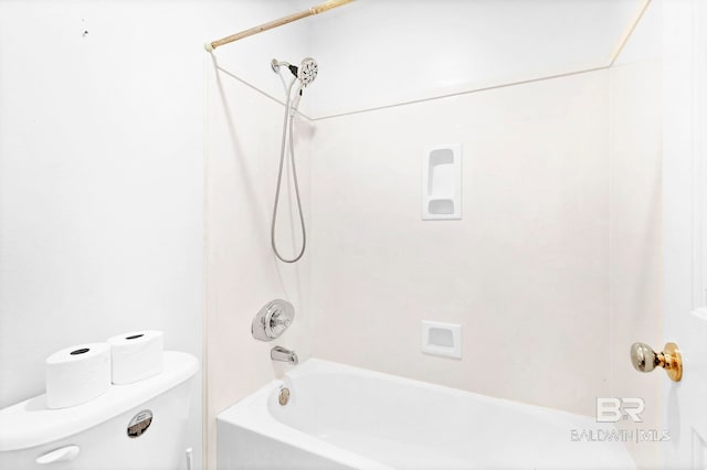 bathroom featuring shower / bathtub combination and toilet