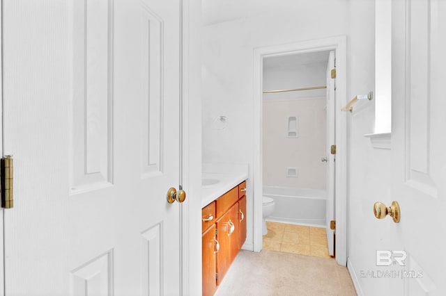full bath featuring toilet, tile patterned flooring, vanity, and tub / shower combination