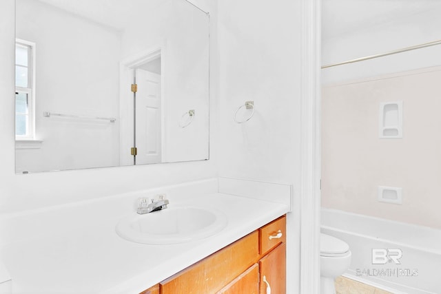 full bath featuring vanity and toilet