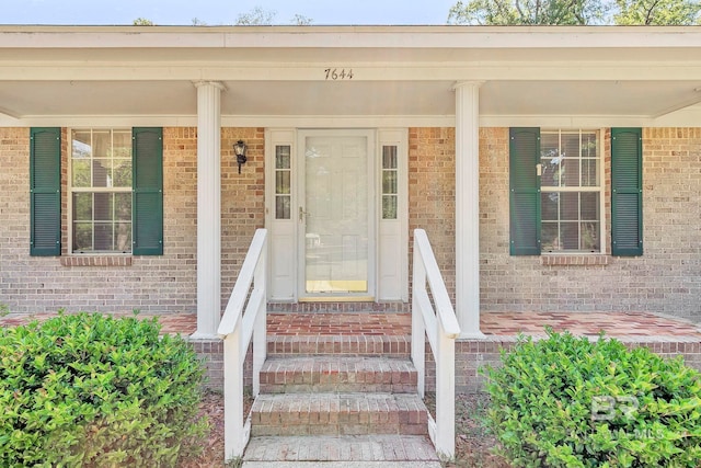 property entrance with brick siding