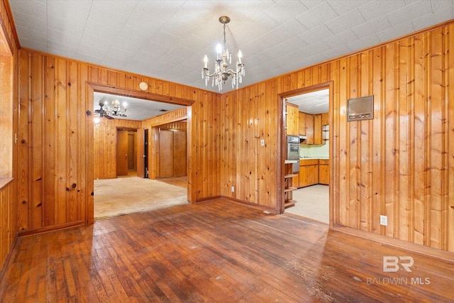 interior space featuring a chandelier and hardwood / wood-style floors