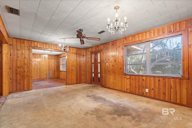 unfurnished room featuring a notable chandelier and light colored carpet