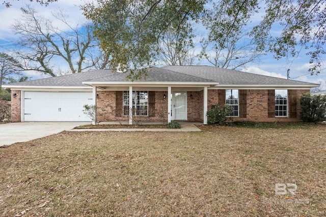 ranch-style house with a garage and a front lawn