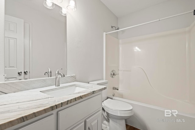 full bathroom featuring vanity, shower / tub combination, and toilet