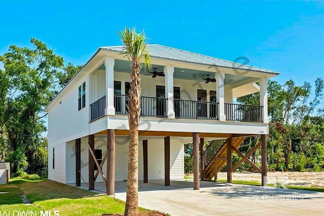 exterior space with a carport and ceiling fan