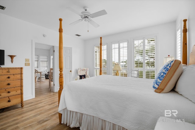 bedroom with ceiling fan and light wood-type flooring