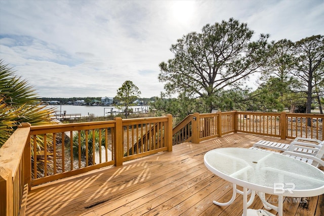 wooden deck featuring a water view