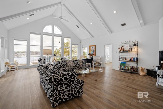 living room featuring beamed ceiling, ceiling fan, hardwood / wood-style floors, and high vaulted ceiling