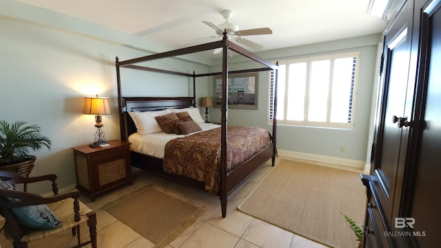 tiled bedroom with ceiling fan