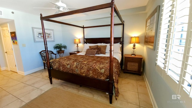 bedroom with ceiling fan and light tile patterned flooring