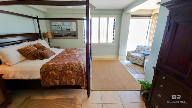 bedroom featuring ceiling fan and light tile patterned flooring