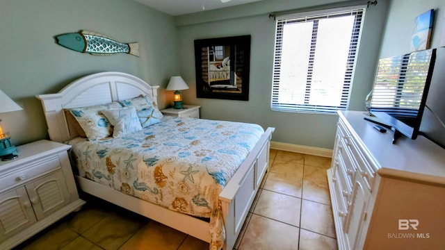 bedroom featuring light tile patterned flooring