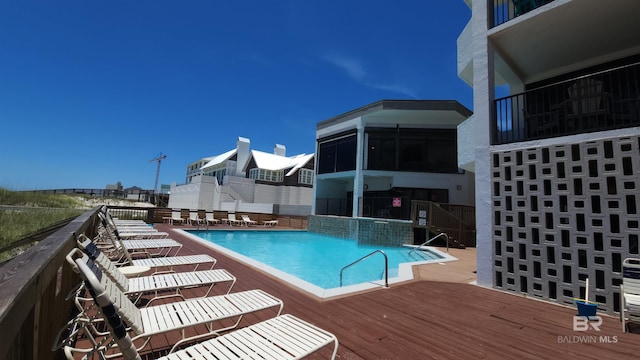 view of pool featuring a wooden deck