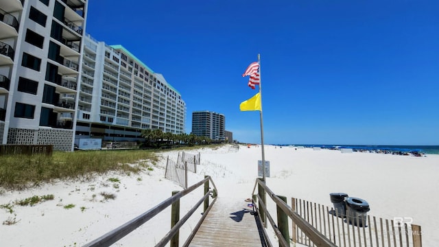 exterior space featuring a water view and a view of the beach