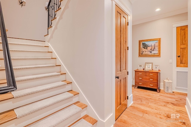 stairway featuring wood-type flooring