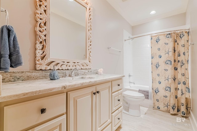 full bathroom featuring vanity, shower / bath combo, and toilet