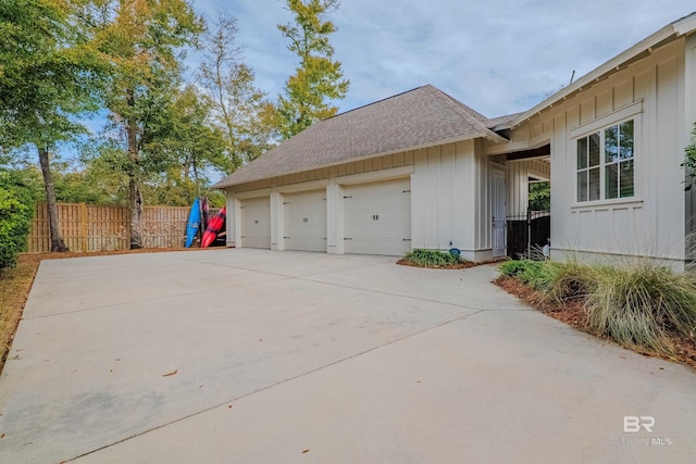 view of side of property with a garage