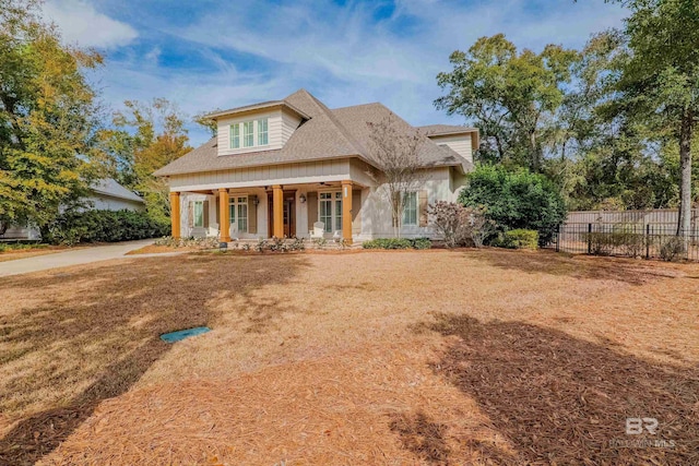 view of front of home with a front lawn and covered porch