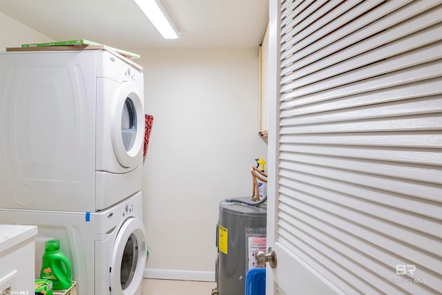 laundry area featuring electric water heater and stacked washer / drying machine