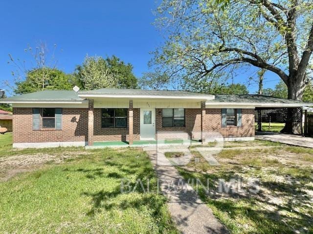 208 Lee St, Atmore, AL 36502 - single story home featuring a carport, brick siding, and a front yard