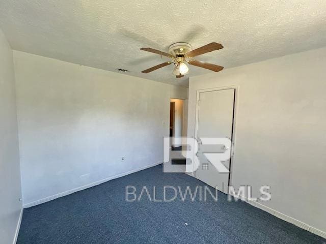 208 Lee St, Atmore, AL 36502 - carpeted spare room with visible vents, a ceiling fan, and baseboards
