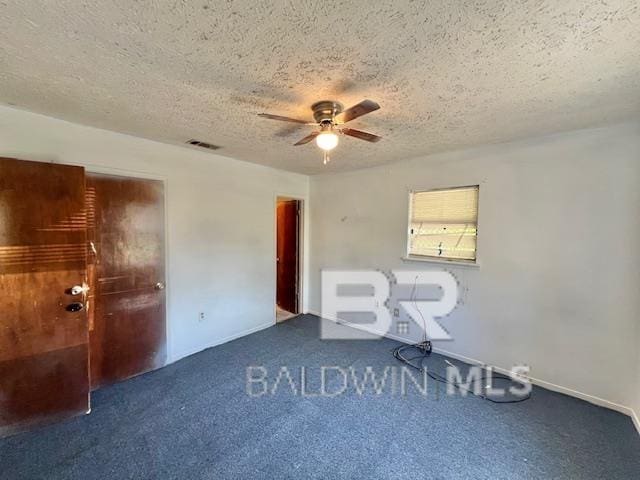 208 Lee St, Atmore, AL 36502 - empty room with a ceiling fan, a textured ceiling, carpet, baseboards, and visible vents