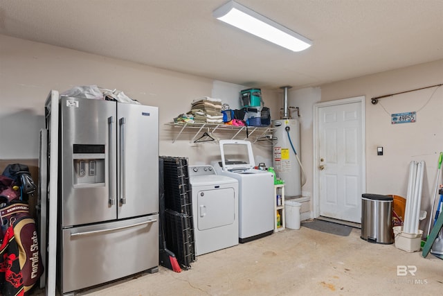 laundry area with laundry area, gas water heater, and washing machine and dryer