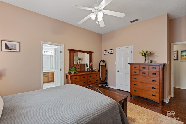 bedroom with dark wood-style floors, baseboards, visible vents, and ceiling fan