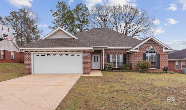 view of front of house featuring an attached garage, a front lawn, concrete driveway, and brick siding