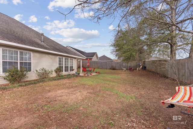 view of yard featuring a fenced backyard and a patio