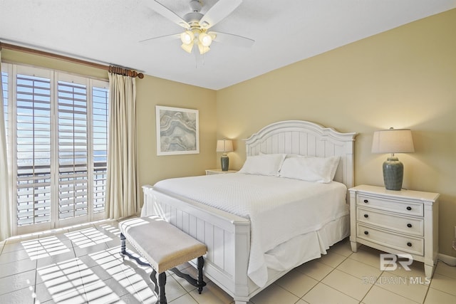 bedroom with light tile patterned floors and a ceiling fan