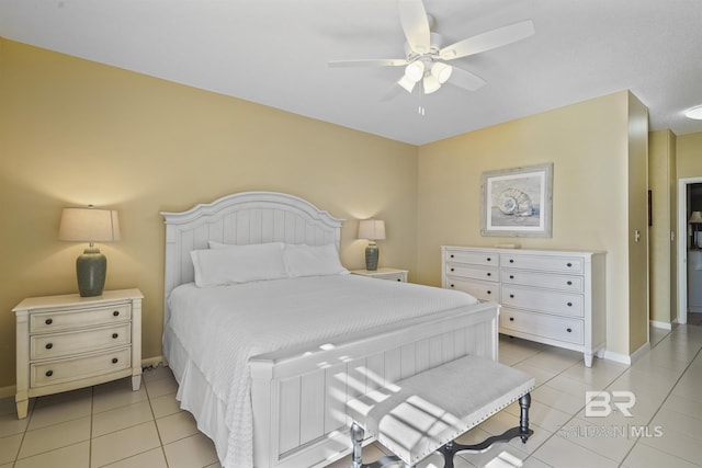 bedroom with ceiling fan, baseboards, and light tile patterned flooring