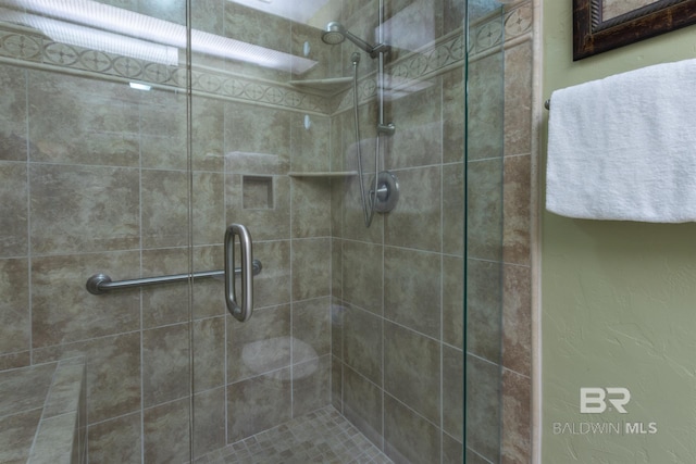 full bathroom featuring a shower stall