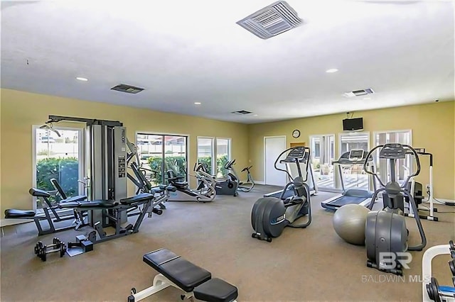 workout area with a wealth of natural light, visible vents, and recessed lighting