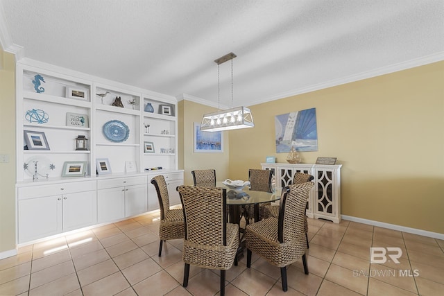 dining area with a textured ceiling, light tile patterned flooring, baseboards, and crown molding