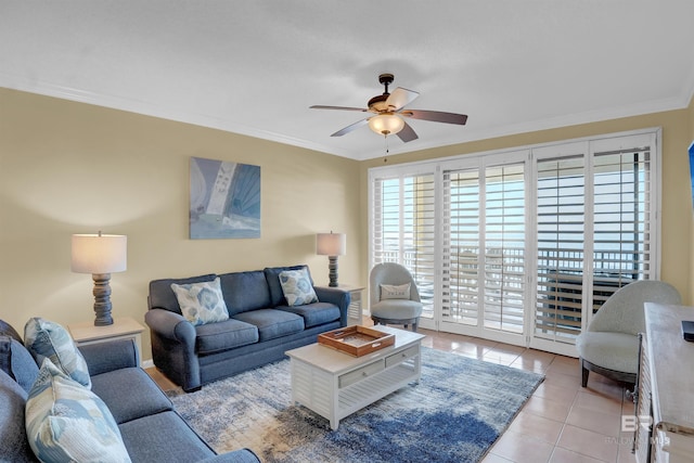 living room featuring light tile patterned flooring, a ceiling fan, and crown molding