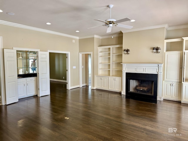 unfurnished living room featuring crown molding, a fireplace with flush hearth, dark wood-type flooring, a ceiling fan, and baseboards