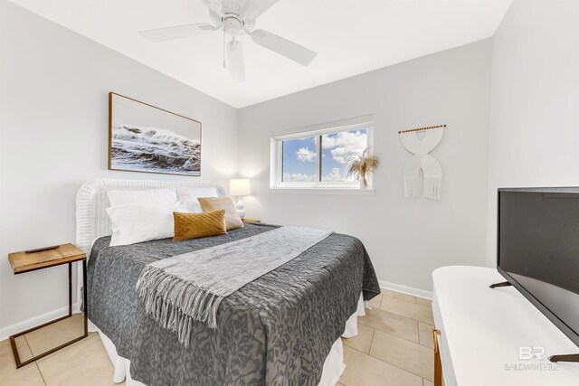 tiled bedroom featuring ceiling fan