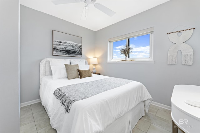 tiled bedroom with ceiling fan