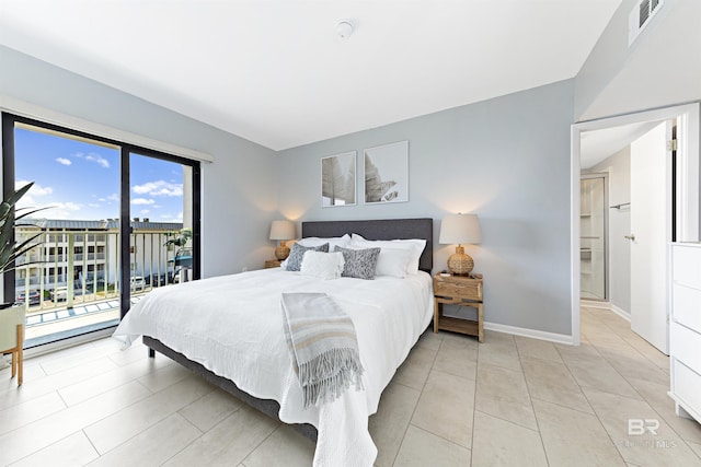 tiled bedroom featuring access to outside