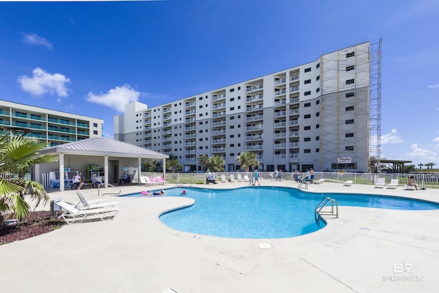 view of swimming pool with a patio