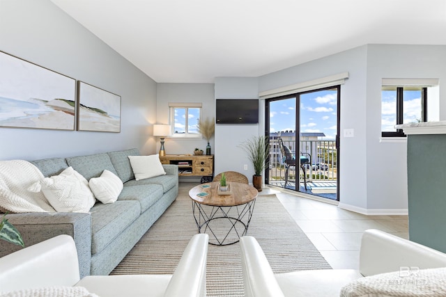 living room featuring tile patterned floors and a wealth of natural light